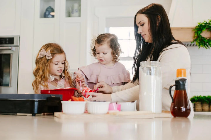 A parent cooking with children